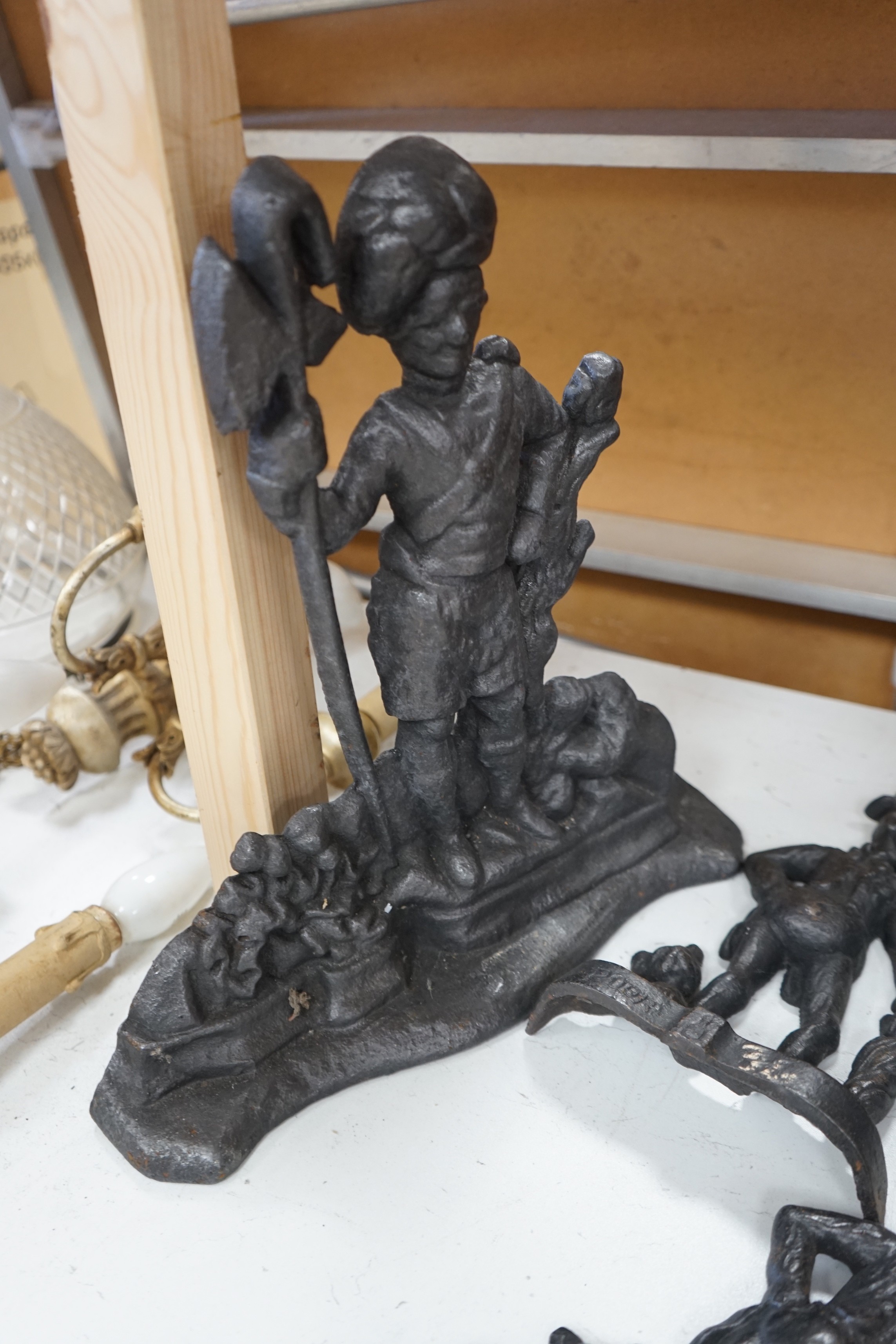 Five assorted Victorian figural cast iron doorstops